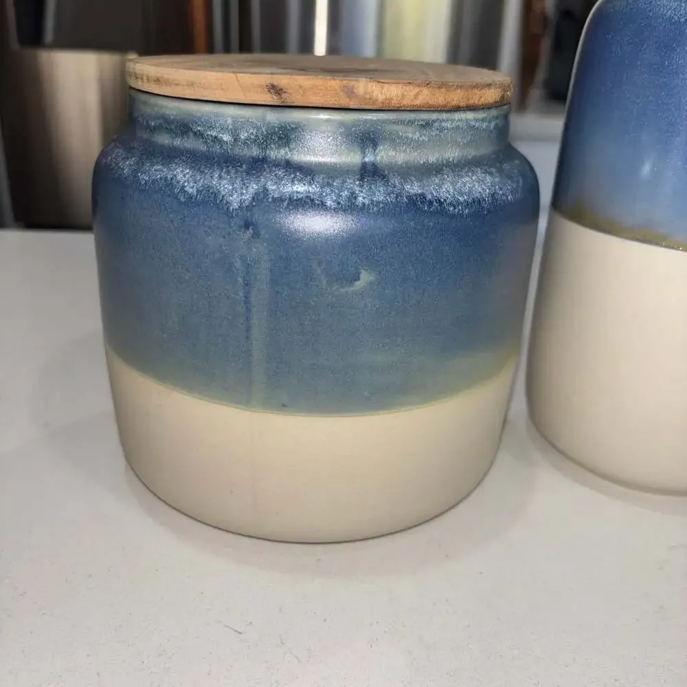 Set of 2 World Market Blue and Cream Ceramic Canisters Wooden Lids